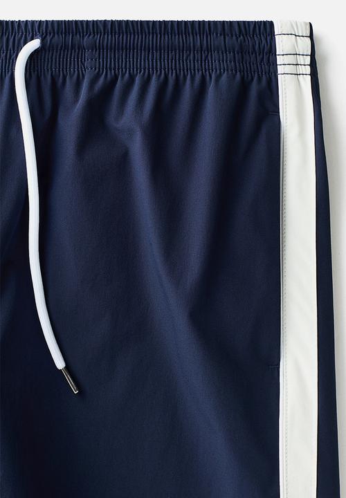 H&M - Regular fit track shorts - navy blue/white