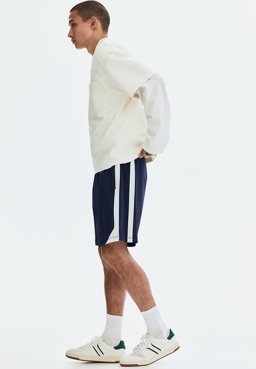 H&M - Regular fit track shorts - navy blue/white