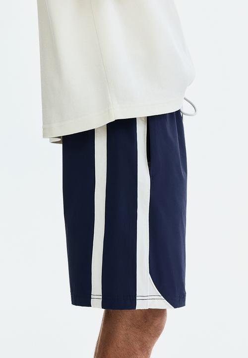 H&M - Regular fit track shorts - navy blue/white