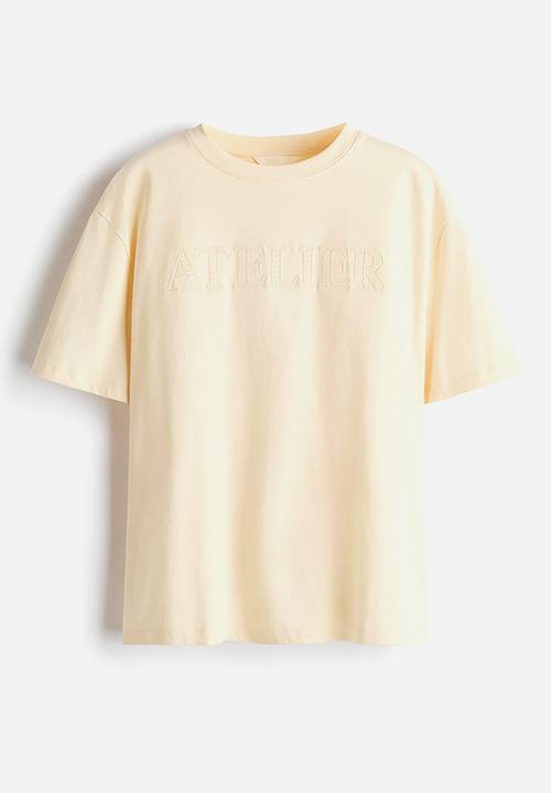 H&M - Oversized T-shirt - light yellow/atelier