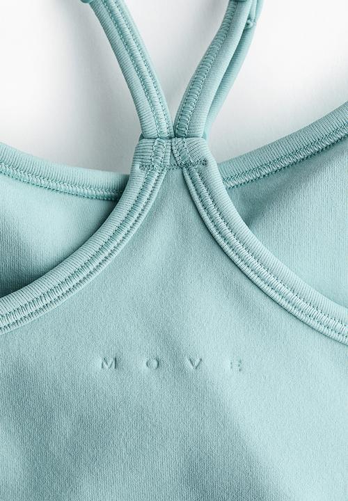 H&M - Seamless sports top with drymove - light turquoise