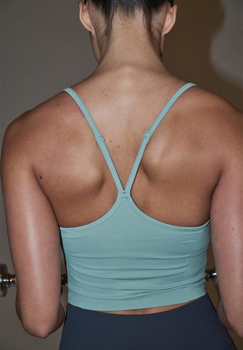 H&M - Seamless sports top with drymove - light turquoise