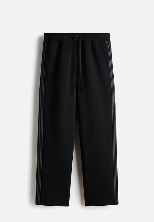 H&M - Loose fit sports joggers with drymove? - black
