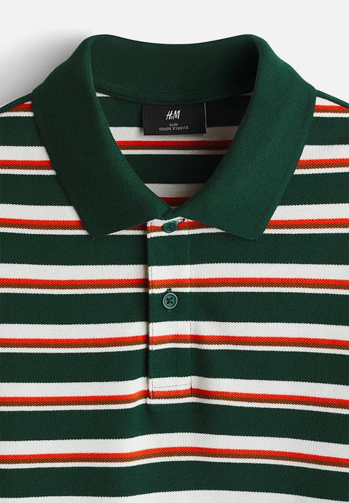H&M - Slim fit polo shirt - dark green/striped