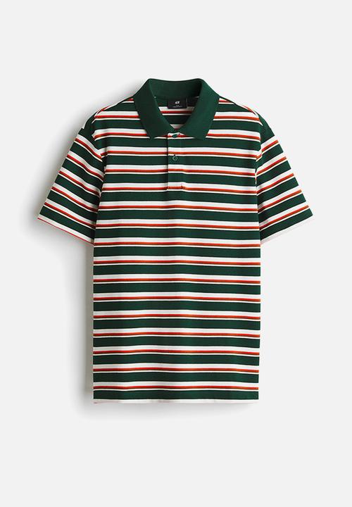 H&M - Slim fit polo shirt - dark green/striped