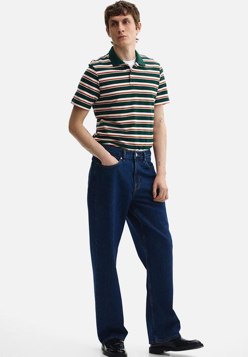H&M - Slim fit polo shirt - dark green/striped