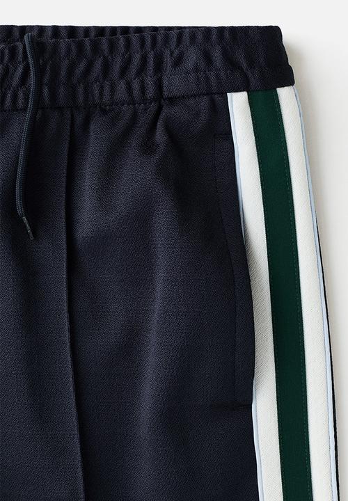 H&M - Relaxed fit track pants - navy blue/stripes