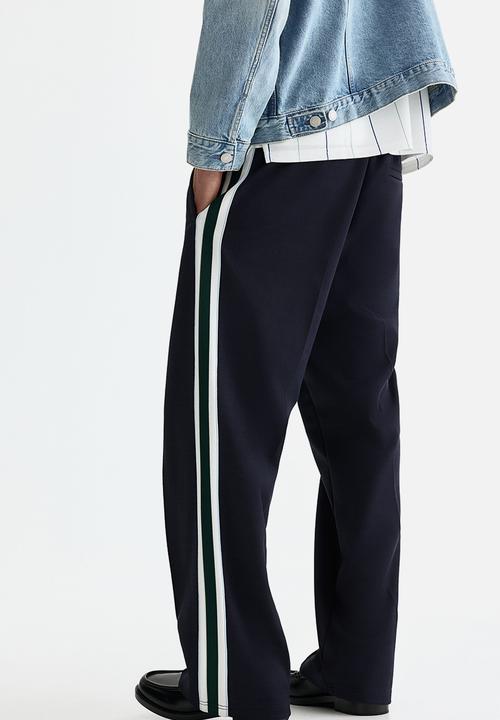 H&M - Relaxed fit track pants - navy blue/stripes