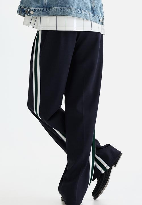 H&M - Relaxed fit track pants - navy blue/stripes