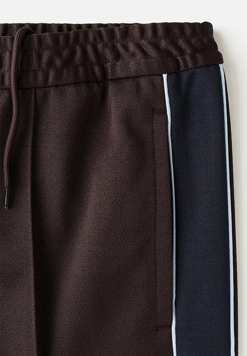 H&M - Relaxed fit track pants - brown/stripes