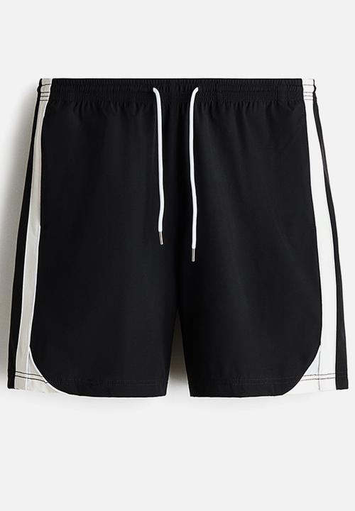 H&M - Regular fit track shorts - black/colour block