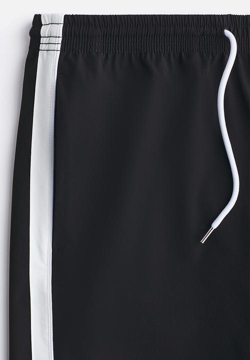 H&M - Regular fit track shorts - black/colour block