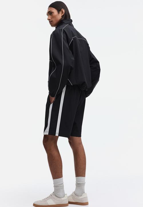 H&M - Regular fit track shorts - black/colour block