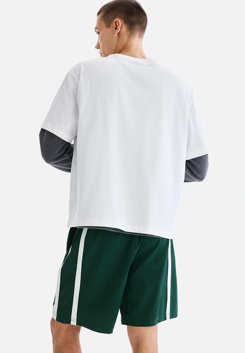H&M - Regular fit track shorts - dark green/colour block