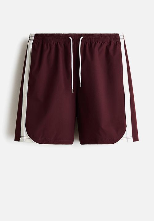 H&M - Regular fit track shorts - burgundy/colour block