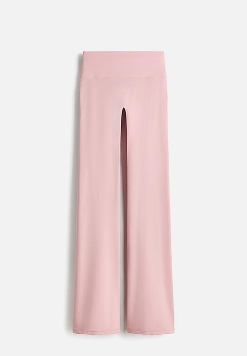 H&M - Flared yoga leggings with softmove. - pastel pink
