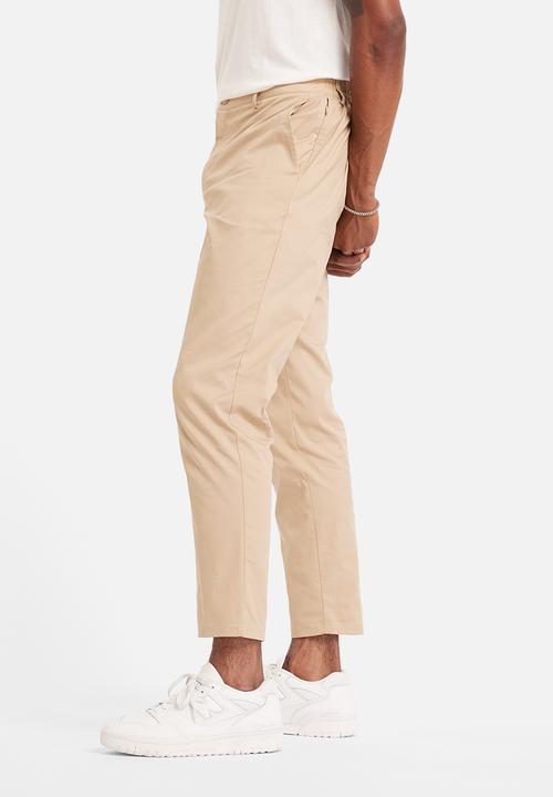 New Balance  - NB Athletics Tapered Pant - Brown