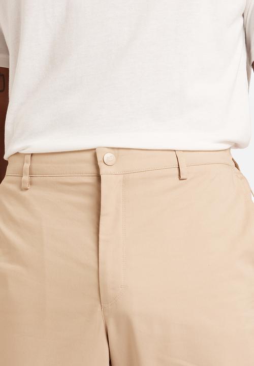 New Balance  - NB Athletics Tapered Pant - Brown