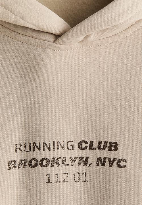 H&M - Loose fit hoodie - beige/running club