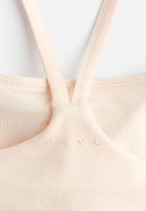 H&M - Medium support sports strappy top with softmove? - butter yellow