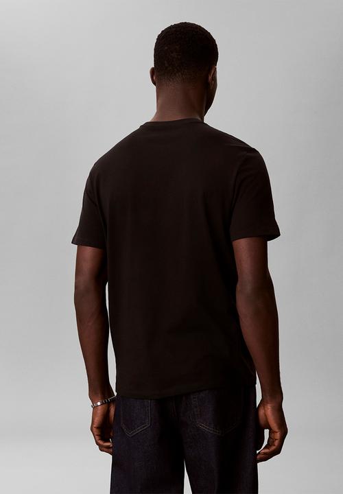 Calvin Klein - SS 30S DISTRESS MONOGRAM GRAPHIC TEE - Black
