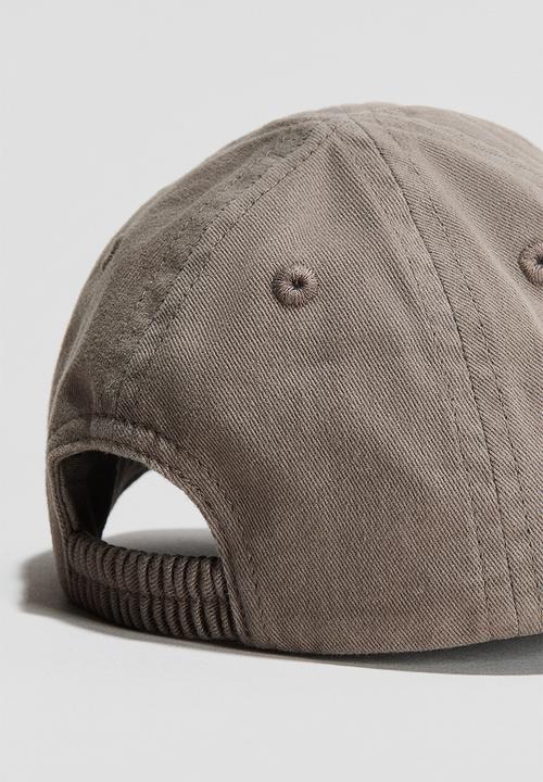 H&M - Cotton cap - mole/dinosaurs