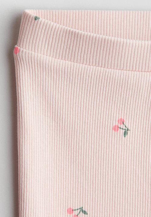 H&M - Flared leggings - light pink/cherries