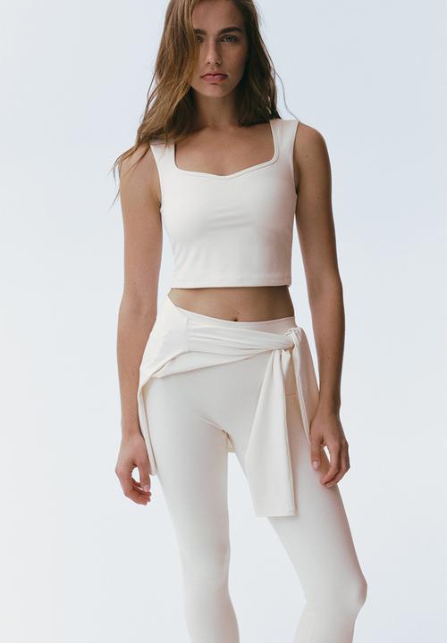 H&M - Sports vest top with sculptmove™ - ivory