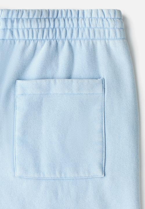 H&M - Relaxed fit shorts - light blue/all sports club