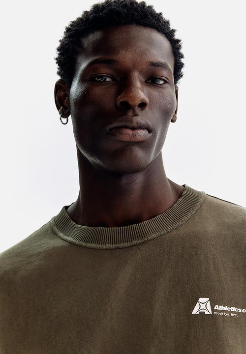 H&M - Printed loose fit t-shirt - brown/athletics co