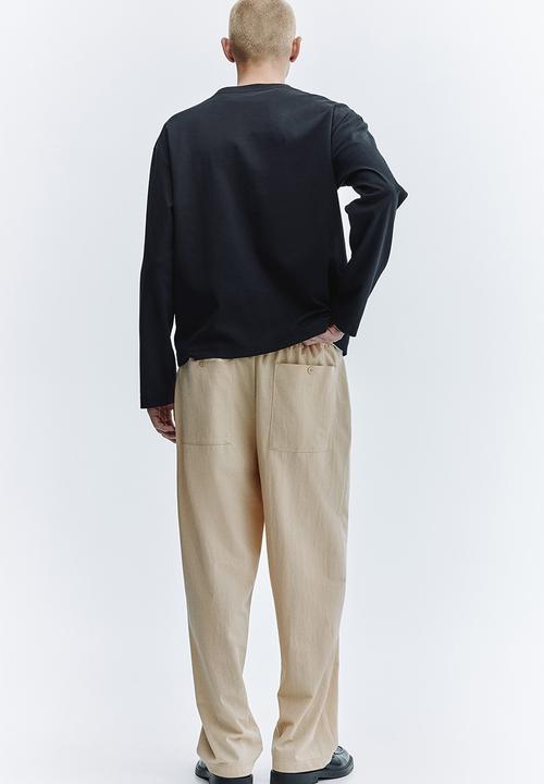 H&M - Regular fit cotton-blend trousers - beige