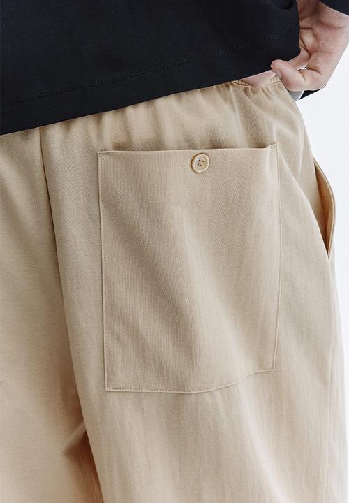 H&M - Regular fit cotton-blend trousers - beige