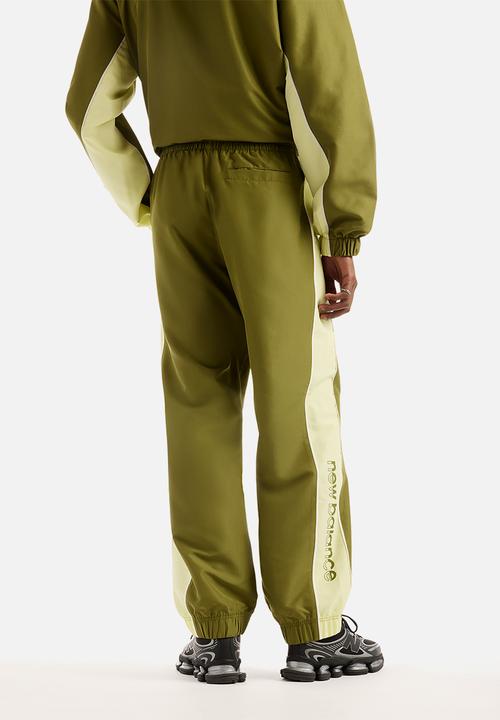 New Balance  - New Balance Trackside Woven Pant - green