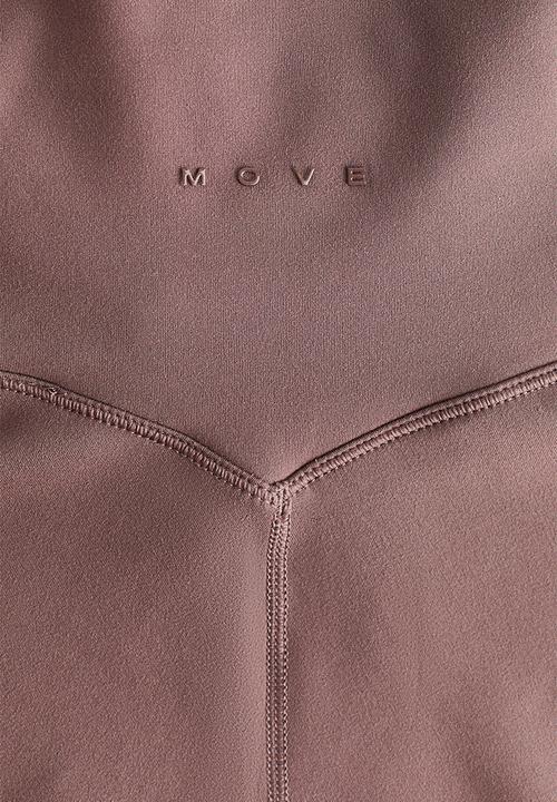 H&M - Flared yoga leggings with softmove™ - light truffle