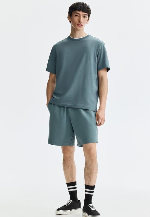 H&M - Regular fit sweatshorts - light dusty teal