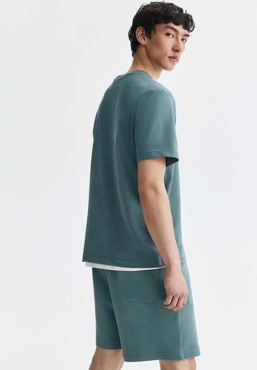 H&M - Regular fit sweatshorts - light dusty teal