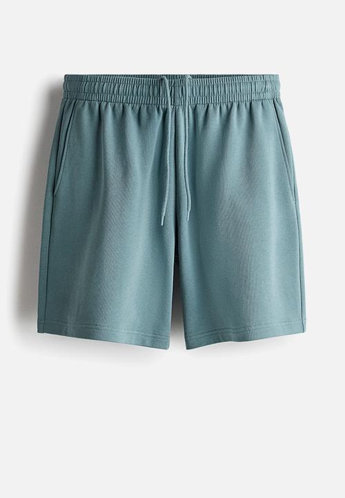 H&M - Regular fit sweatshorts - light dusty teal