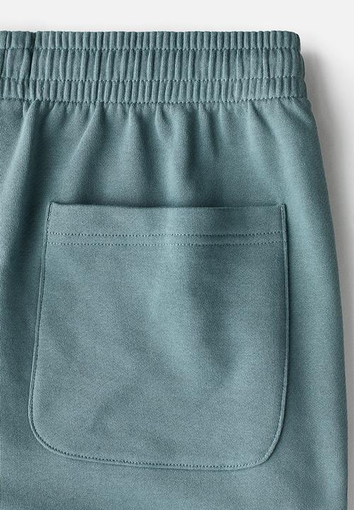 H&M - Regular fit sweatshorts - light dusty teal