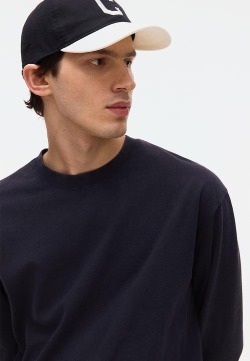 H&M - Loose fit printed long-sleeved top - navy blue/sports archives