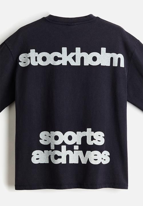H&M - Loose fit printed long-sleeved top - navy blue/sports archives