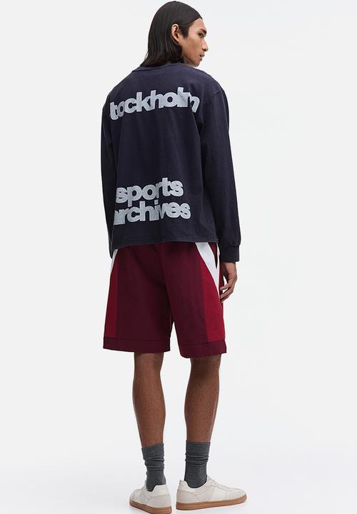 H&M - Loose fit track shorts - burgundy/colour block