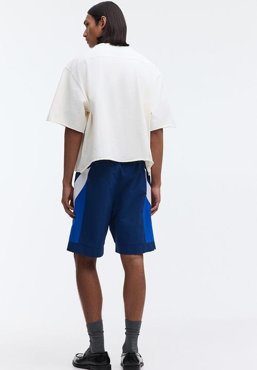 H&M - Loose fit track shorts - dark blue/colour block