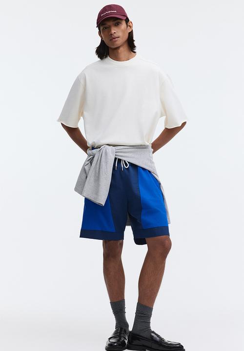 H&M - Loose fit track shorts - dark blue/colour block