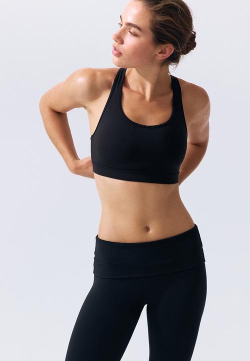 H&M - Fold-over flared sports leggings with lycra® - black