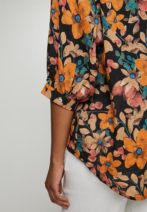 Izabel London - Half Sleeve Batwing Easy Wearing Printed Sheer Blouse With Back Button Stand Detail - Black Multi