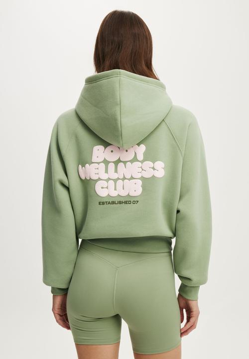 Cotton On - Plush Premium Graphic Raglan Hoodie - Matcha/Body Wellness