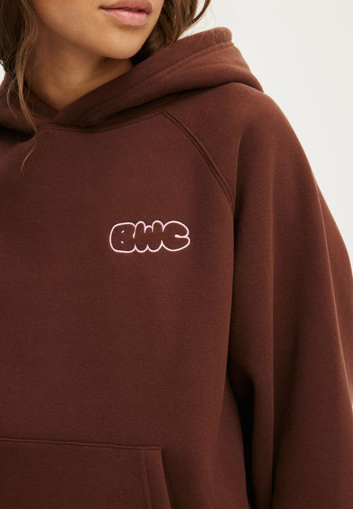 Cotton On - Plush Premium Graphic Raglan Hoodie - Chestnut/Body Wellness