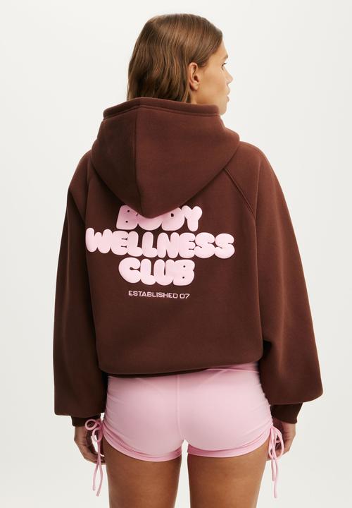 Cotton On - Plush Premium Graphic Raglan Hoodie - Chestnut/Body Wellness