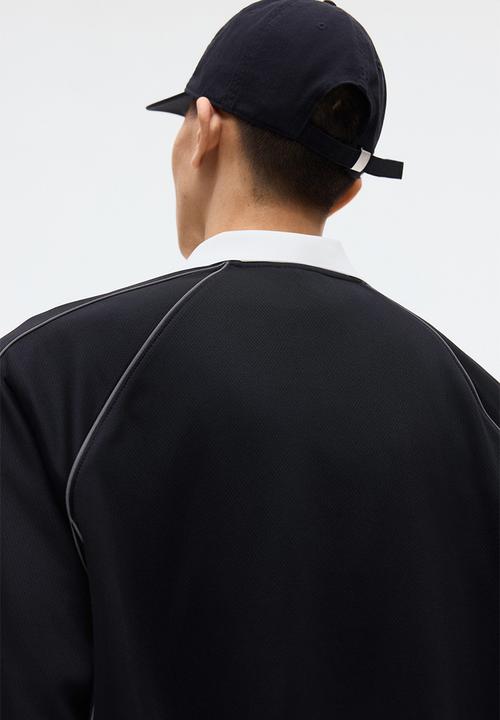 H&M - Loose fit printed polo shirt - black/honda