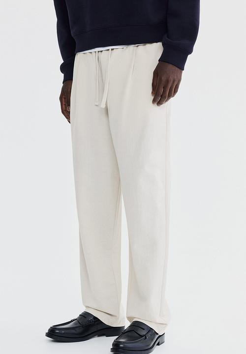 H&M - Regular fit cotton-blend trousers - light beige